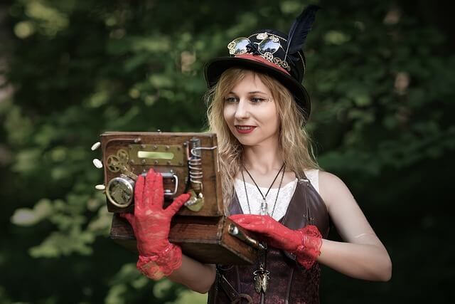 Steampunk cosplayer holding a handmade prop with gears and vintage aesthetic